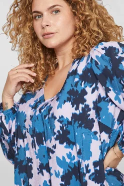 Blusa estampada manga comprida curvilínea